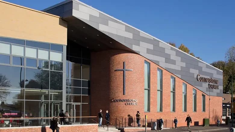 Exterior of Cornerstone Church Nottingham showing the modern brick building with cross and church signage