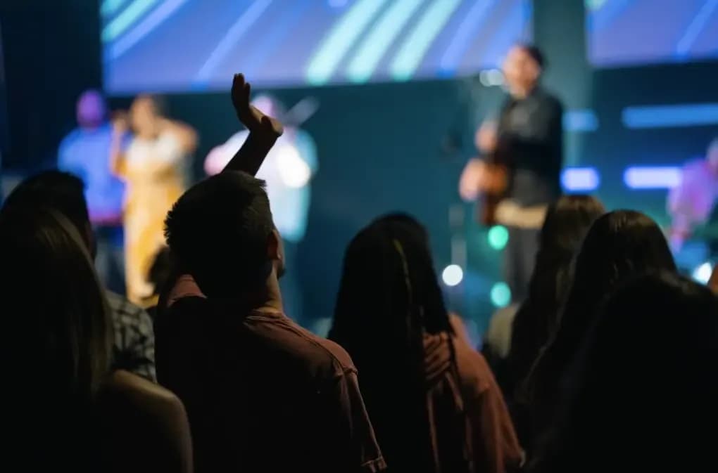 Congregation worshiping with hands raised during a Second Baptist Church worship service