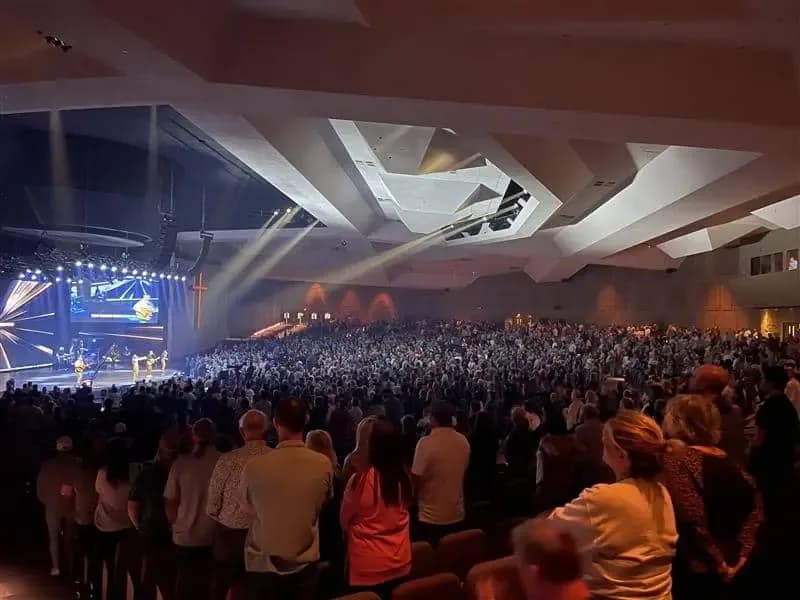 Interior worship space of Lakepointe Church filled with a large congregation facing the stage